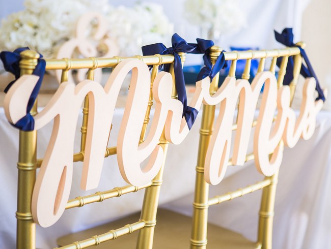 10 Adorably Fun Wedding Chair Signs & Covers for Bride and Groom